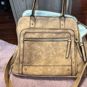 Very cute light brown purse from charming Charlie